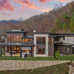 living-stone-–-stoneridge-haven-–-laurel-ridge-farms-–-waynesville-nc-–-custom-home-–-exterior-rear-dusk-aerial-–-02