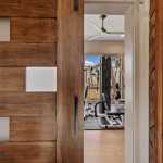 living-stone-–-stoneridge-haven-–-laurel-ridge-farms-–-waynesville-nc-–-custom-home-–-home-gym-barn-door-wood-accent-wall-–-17