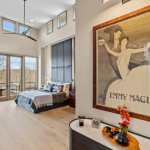 living-stone-–-stoneridge-haven-–-laurel-ridge-farms-–-waynesville-nc-–-custom-home-–-primary-bedroom-upholstered-wall-balcony-–-12