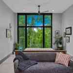living-stone-–-wandering-oaks-modern-–-asheville-nc-–-custom-home-–-bedroom-floor-to-ceiling-windows-gallery-wall-–-13