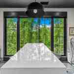 living-stone-–-wandering-oaks-modern-–-asheville-nc-–-custom-home-–-home-office-white-desk-ergonomic-chairs-forest-view-–-20