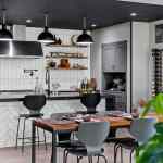 living-stone-–-wandering-oaks-modern-–-asheville-nc-–-custom-home-–-kitchen-dining-black-pendants-white-tile-wine-rack-–-06