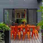 living-stone-–-wandering-oaks-modern-–-asheville-nc-–-custom-home-–-outdoor-deck-orange-dining-set-string-lights-–-19