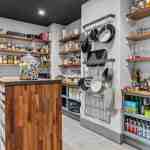 living-stone-–-wandering-oaks-modern-–-asheville-nc-–-custom-home-–-pantry-butcher-block-island-open-shelving-–-04