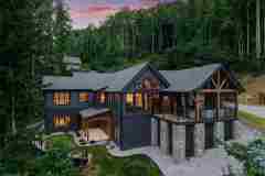 living-stone-–-daydream-rustic-modern-–-high-hickory-–-swannanoa-nc-–-custom-home-build-–-aerial-twilight-exterior-–-01