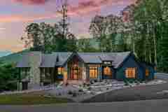 living-stone-–-daydream-rustic-modern-–-high-hickory-–-swannanoa-nc-–-custom-home-build-–-aerial-twilight-mountain-view-–-02