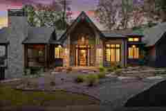 living-stone-–-daydream-rustic-modern-–-high-hickory-–-swannanoa-nc-–-custom-home-build-–-twilight-entry-stone-gable-–-04