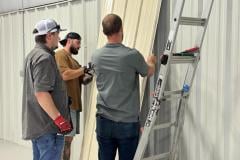 living-stone-crew-installing-metal-wall-panel-04
