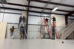 living-stone-team-installing-wall-panels-warehouse-05