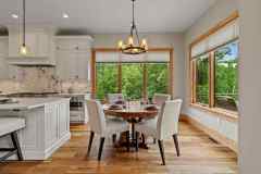 living-stone-–-north-haven-rustic-–-creston-–-black-mountain-nc-–-custom-home-–-breakfast-nook-round-table-forest-view-–-21