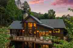 living-stone-–-north-haven-rustic-–-creston-–-black-mountain-nc-–-custom-home-–-exterior-twilight-aerial-rear-–-18
