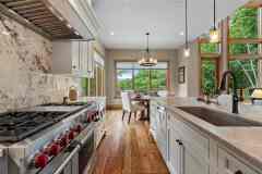 living-stone-–-north-haven-rustic-–-creston-–-black-mountain-nc-–-custom-home-–-kitchen-range-marble-slab-backsplash-–-20