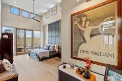 living-stone-–-stoneridge-haven-–-laurel-ridge-farms-–-waynesville-nc-–-custom-home-–-primary-bedroom-upholstered-wall-balcony-–-12