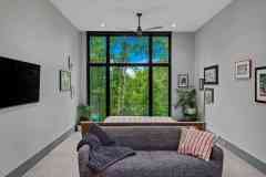 living-stone-–-wandering-oaks-modern-–-asheville-nc-–-custom-home-–-bedroom-floor-to-ceiling-windows-gallery-wall-–-13