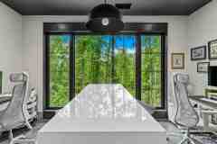 living-stone-–-wandering-oaks-modern-–-asheville-nc-–-custom-home-–-home-office-white-desk-ergonomic-chairs-forest-view-–-20
