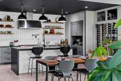 living-stone-–-wandering-oaks-modern-–-asheville-nc-–-custom-home-–-kitchen-dining-black-pendants-white-tile-wine-rack-–-06
