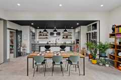 living-stone-–-wandering-oaks-modern-–-asheville-nc-–-custom-home-–-kitchen-dining-open-concept-barn-door-wine-rack-–-12