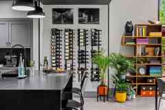 living-stone-–-wandering-oaks-modern-–-asheville-nc-–-custom-home-–-kitchen-wine-wall-rack-open-bookshelf-–-07