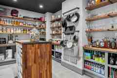 living-stone-–-wandering-oaks-modern-–-asheville-nc-–-custom-home-–-pantry-butcher-block-island-open-shelving-–-04