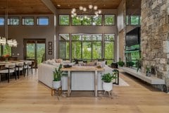 living-stone-–-waterfall-overlook-–-hendersonville-nc-–-custom-home-–-great-room-sofa-stone-column-tv-–-06